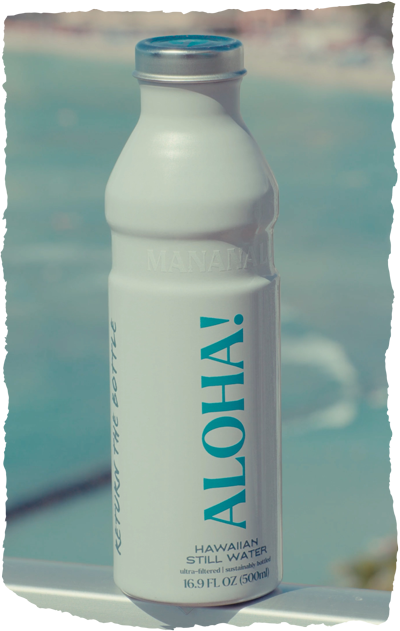 Mananalu bottle on a railing overlooking the ocean